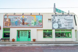 the side of dublin bottling works with murals visible, one of the best things to do in dublin texas