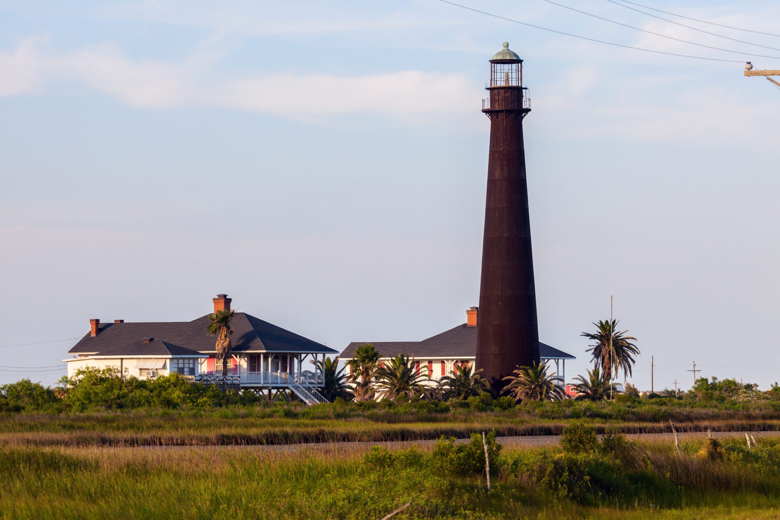 black point bolivar lighthouse with keepers cottages, one of the best texas lighthouses to visit