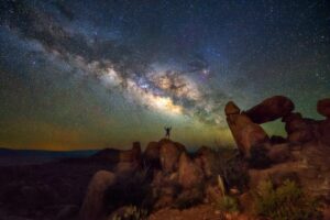 hiker standing under milky way in big bend national park, one of the best things to do in west texas