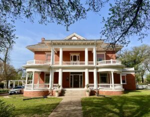 front facade of the red brick kell house museum, one of the best things to do in wichita falls texas
