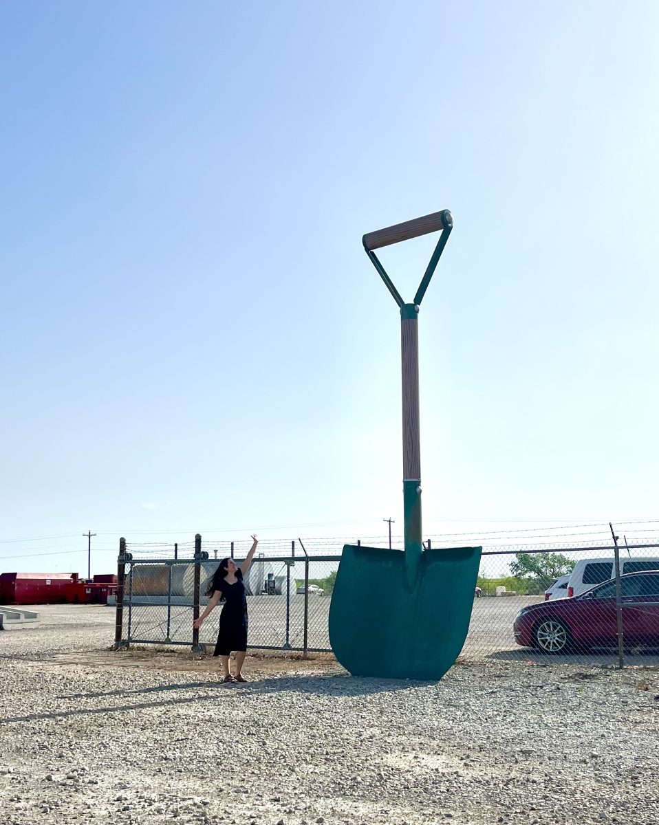 kate storm in front of the largest shovel in texas wichita falls 